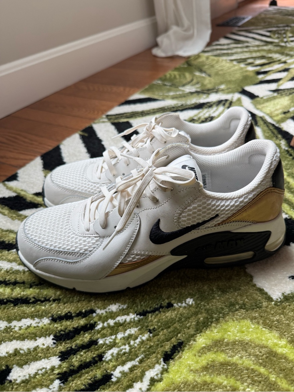 Nike Women’s Sneakers White with Black and Gold Accents